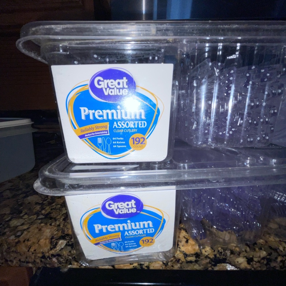 Two containers of plastic silverware